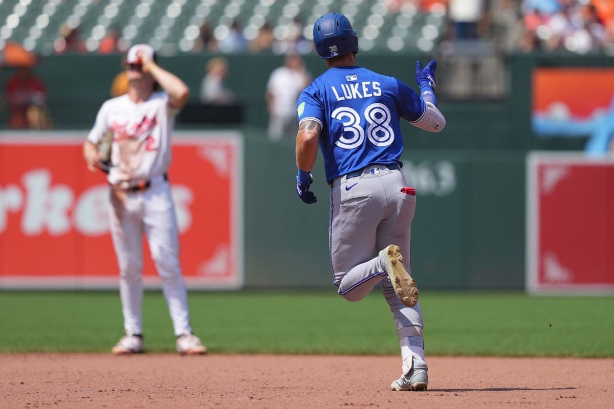 Jul 30, 2025; Baltimore, Maryland, USA; Toronto Blue Jays pinch hitter Nathan Lukes (38) rounds the bases following his three run home during the seventh inning against the Baltimore Orioles at Oriole Park at Camden Yards. Mandatory Credit: Mitch Stringer-Imagn Images