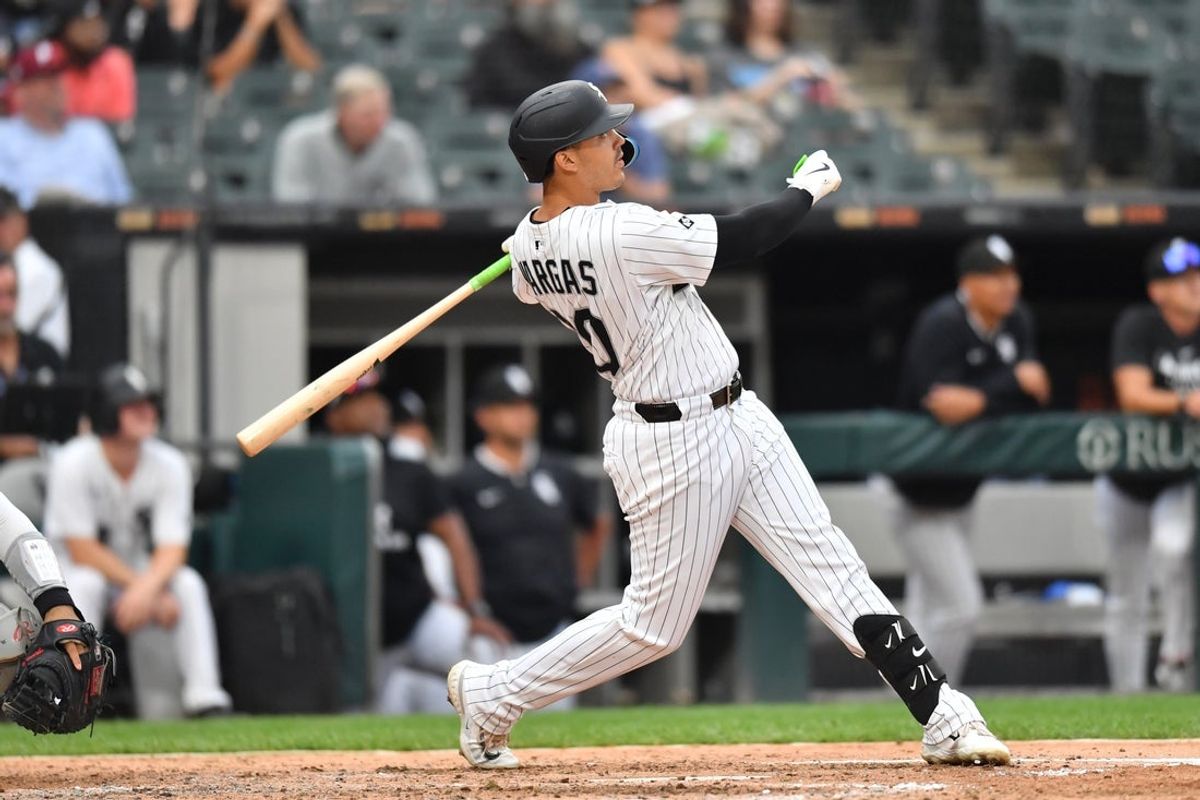 Jul 30, 2025; Chicago, Illinois, USA; Chicago White Sox third baseman Miguel Vargas (20) hits a three-run home run during the seventh inning against the Philadelphia Phillies at Rate Field. Mandatory Credit: Patrick Gorski-Imagn Images