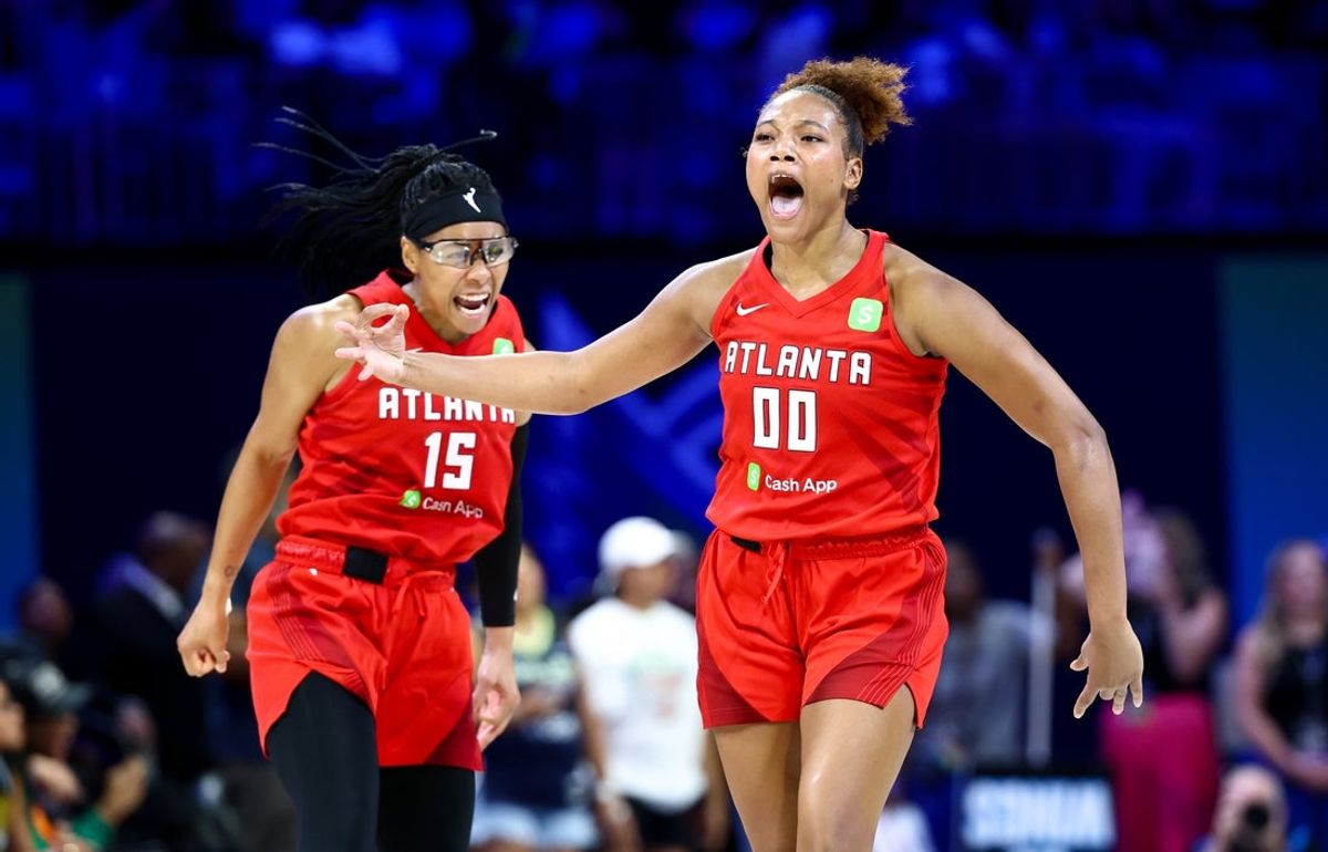Jul 30, 2025; Arlington, Texas, USA;  Atlanta Dream forward Naz Hillmon (00) celebrates with Atlanta Dream guard Allisha Gray (15) after hitting the game-winning shot against the Dallas Wings during the second half at College Park Center. Mandatory Credit: Kevin Jairaj-Imagn Images
