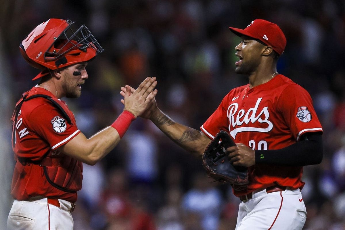 Jul 30, 2025; Cincinnati, Ohio, USA; Cincinnati Reds catcher Tyler Stephenson (37) high fives outfielder Will Benson (30) after the victory over the Los Angeles Dodgers at Great American Ball Park. Mandatory Credit: Katie Stratman-Imagn Images