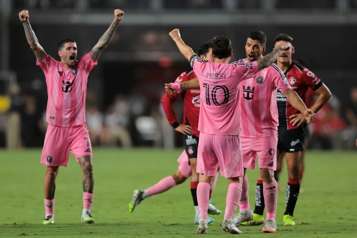 Jul 30, 2025; Ft. Lauderdale, Florida, USA; Inter Miami CF forward Lionel Messi (10) celebrates with forward Luis Suarez (9) and midfielder Rodrigo De Paul (7) after a goal by defender Marcelo Weigandt (not pictured) against Atlas FC during the second half of a group stage Leagues Cup match at Chase Stadium. Mandatory Credit: Sam Navarro-Imagn Images