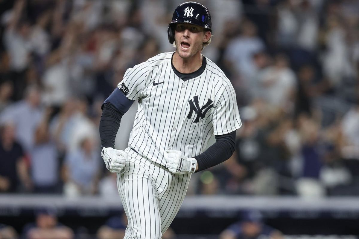 Jul 30, 2025; Bronx, New York, USA;  New York Yankees third baseman Ryan McMahon (19) hits a game winning RBI single in the eleventh inning to defeat the Tampa Bay Rays 5-4 at Yankee Stadium. Mandatory Credit: Wendell Cruz-Imagn Images