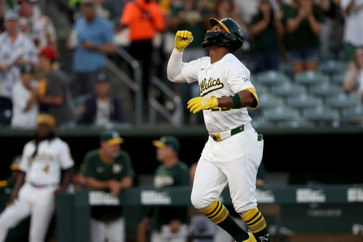 Jul 30, 2025; West Sacramento, California, USA; Athletics third baseman Miguel Andujar (22) reacts after hitting a solo home run against the Seattle Mariners during the fourth inning at Sutter Health Park. Mandatory Credit: Dennis Lee-Imagn Images