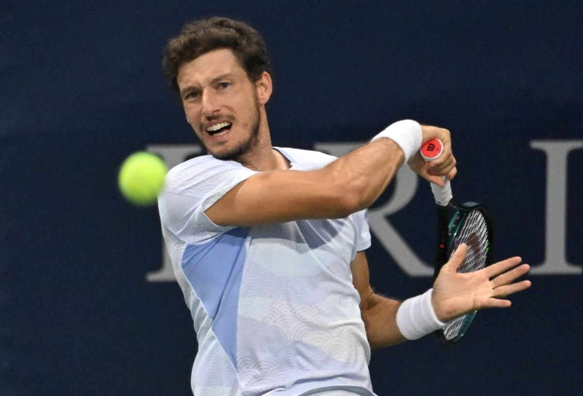 Jul 30, 2025; Toronto, ON, Canada;  Pablo Carreno Busta (ESP) plays a shot against Arthur Fils (FRA) during second round play at Sobeys Stadium. Mandatory Credit: Dan Hamilton-Imagn Images