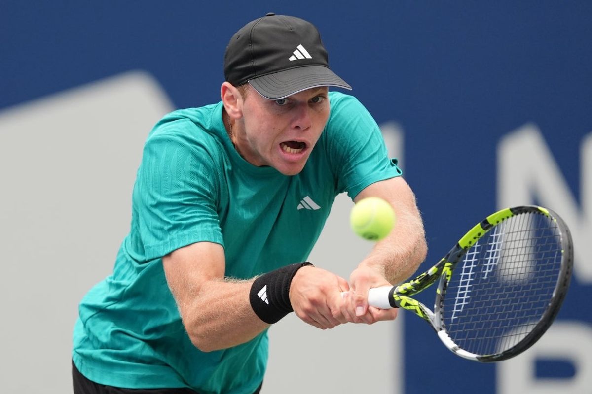 Jul 31, 2025; Toronto, ON, Canada; Alex Michelsen (USA) hits a ball to Lorenzo Musetti (not pictured) during the third round at Sobeys Stadium. Mandatory Credit: John E. Sokolowski-Imagn Images