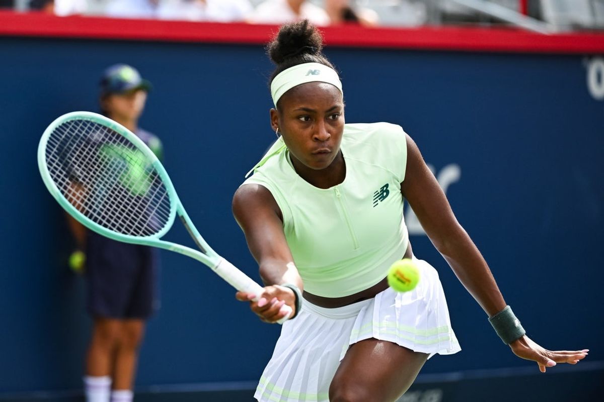 Jul 31, 2025; Montreal, QC, Canada; Coco Gauff (USA) returns the ball to Veronika Kudermetova in third round play at IGA Stadium. Mandatory Credit: David Kirouac-Imagn Images