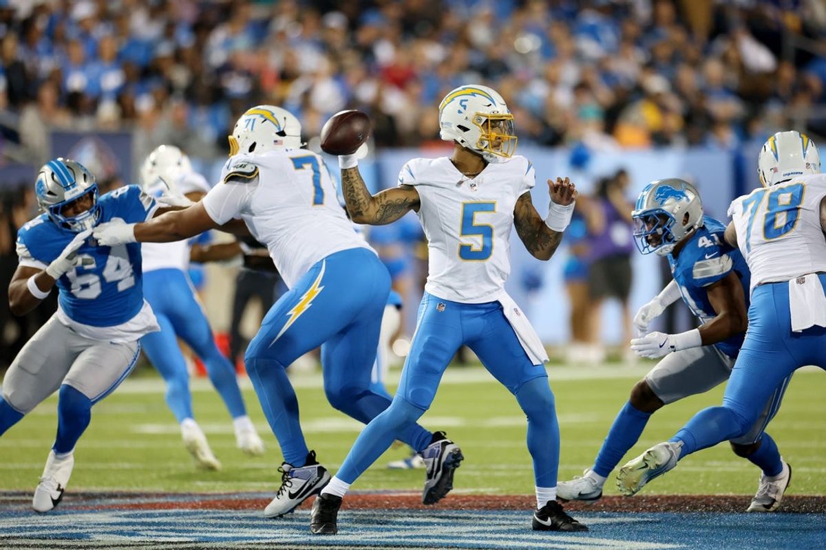 Jul 31, 2025; Canton, Ohio, USA;  Los Angeles Chargers quarterback Trey Lance (5) throws in the second quarter against the Detroit Lions at Tom Benson Hall of Fame Stadium. Mandatory Credit: Scott Galvin-Imagn Images
