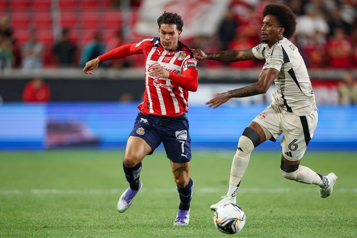 Jul 31, 2025; Harrison, New Jersey, USA; Chivas forward Cade Cowell (7) and New York Red Bulls defender Kyle Duncan (6) battle for the ball during the second half at Sports Illustrated Stadium. Mandatory Credit: Vincent Carchietta-Imagn Images