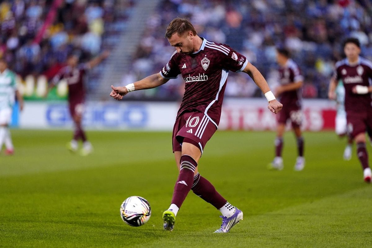 Jul 31, 2025; Commerce City, Colorado, USA; Colorado Rapids midfielder Djordje Mihailovic (10) kicks the ball at the net of Santos Laguna in the first half at Dick's Sporting Goods Park. Mandatory Credit: Ron Chenoy-Imagn Images