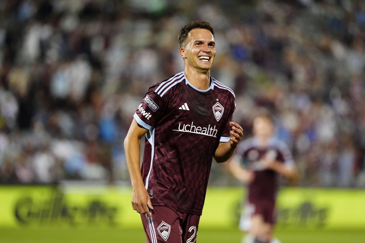 Jul 31, 2025; Commerce City, Colorado, USA; Colorado Rapids midfielder Cole Bassett (23) reacts in the first half against Santos Laguna at Dick's Sporting Goods Park. Mandatory Credit: Ron Chenoy-Imagn Images