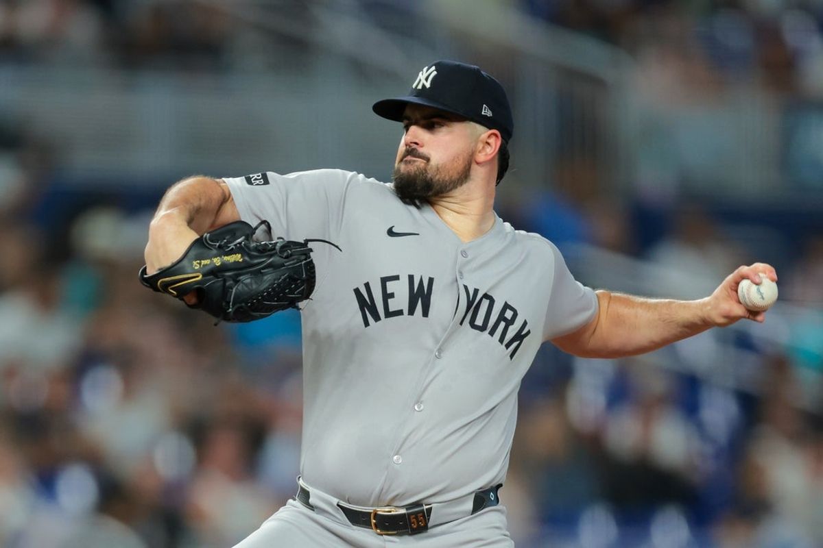 Aug 1, 2025; Miami, Florida, USA; New York Yankees starting pitcher Carlos Rodon (55) delivers a pitch against the Miami Marlins during the first inning at loanDepot Park. Mandatory Credit: Sam Navarro-Imagn Images