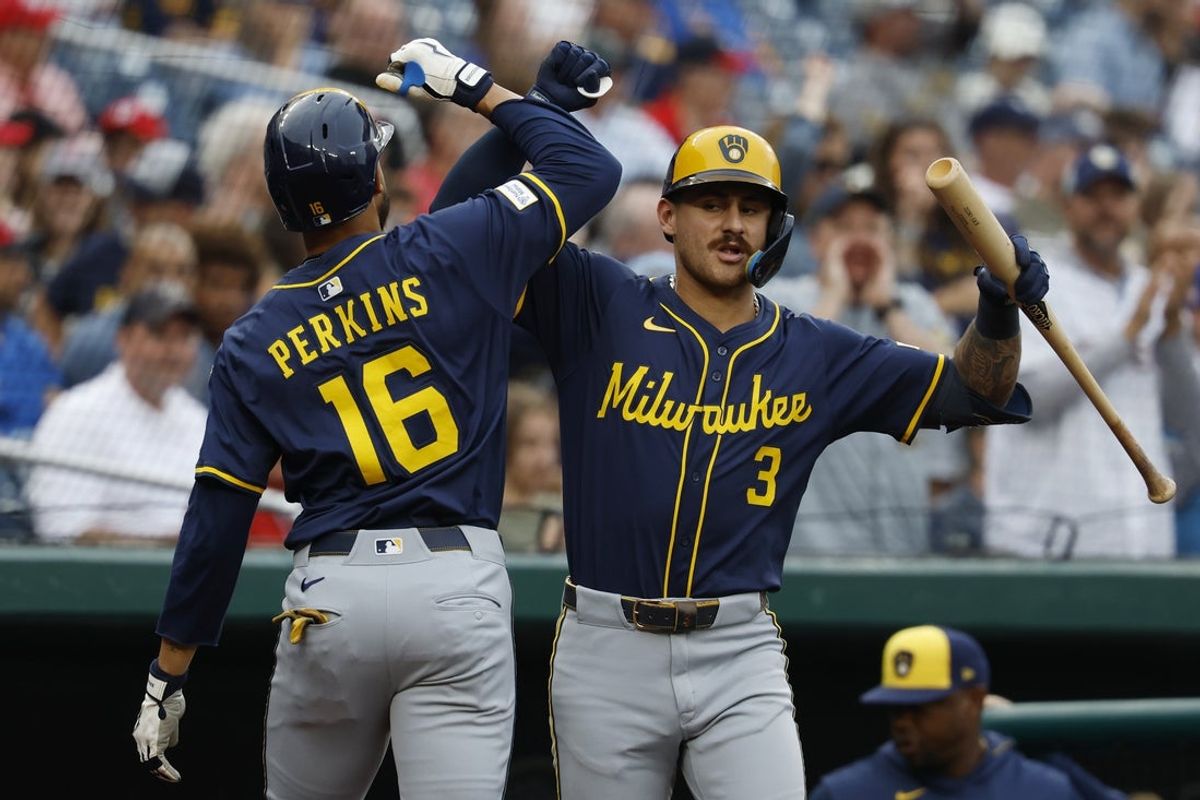 Aug 1, 2025; Washington, District of Columbia, USA; Milwaukee Brewers outfielder Blake Perkins (16) celebrates with Brewers shortstop Joey Ortiz (3) after hitting a solo home run against the Washington Nationals during the second inning at Nationals Park. Mandatory Credit: Geoff Burke-Imagn Images