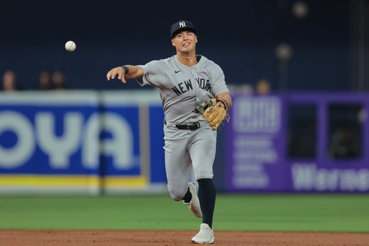 Aug 1, 2025; Miami, Florida, USA; New York Yankees shortstop Anthony Volpe (11) throws to first base to retire Miami Marlins shortstop Otto Lopez (not pictured) during the second inning at loanDepot Park. Mandatory Credit: Sam Navarro-Imagn Images