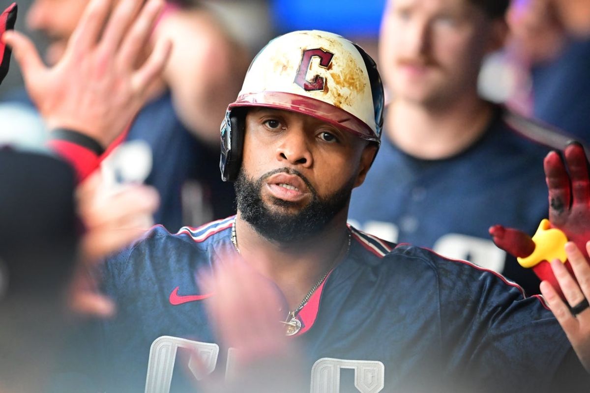 Aug 1, 2025; Cleveland, Ohio, USA; Cleveland Guardians first baseman Carlos Santana (41) celebrates after scoring during the second inning against the Minnesota Twins at Progressive Field. Mandatory Credit: Ken Blaze-Imagn Images