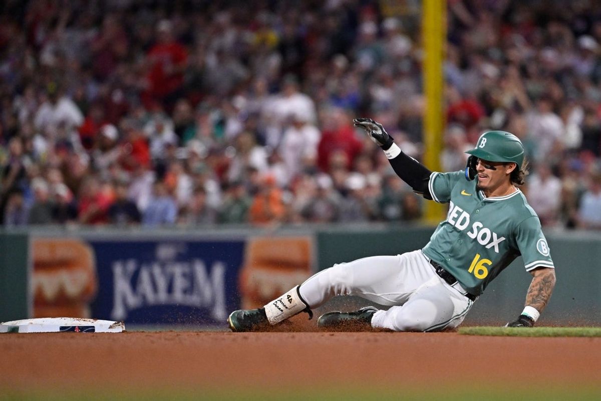 Aug 1, 2025; Boston, Massachusetts, USA; Boston Red Sox center fielder Jarren Duran (16) slides into second base during the sixth inning against the Houston Astros at Fenway Park. Mandatory Credit: Eric Canha-Imagn Images