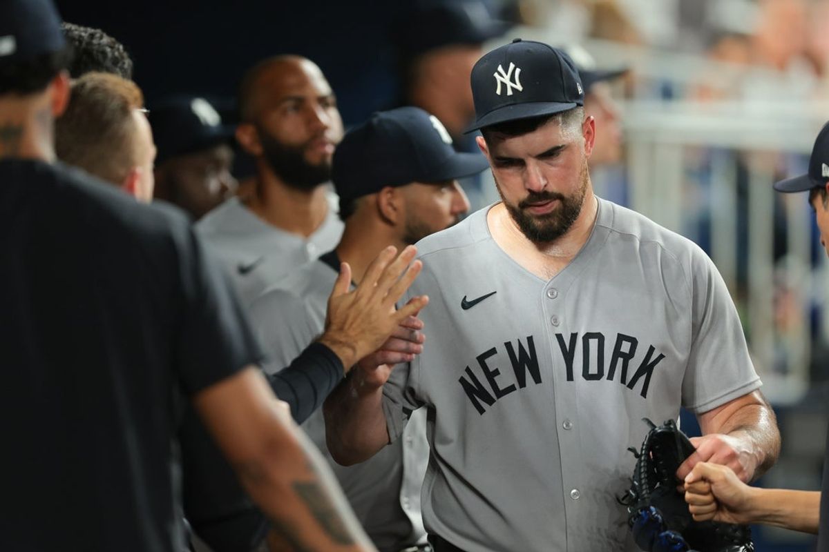 Aug 1, 2025; Miami, Florida, USA; New York Yankees starting pitcher Carlos Rodon (55) celebrates with teammates after exiting the game against the Miami Marlins during the fifth inning at loanDepot Park. Mandatory Credit: Sam Navarro-Imagn Images