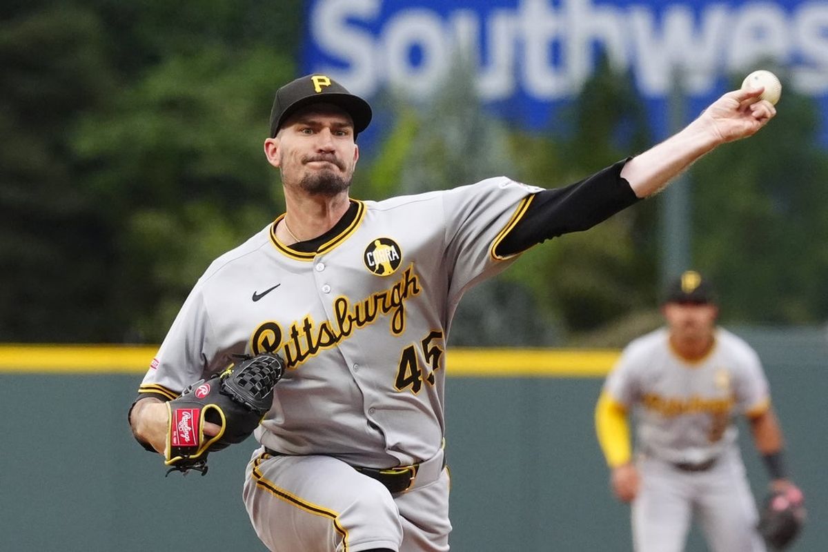 Aug 1, 2025; Denver, Colorado, USA; Pittsburgh Pirates starting pitcher Andrew Heaney (45) delivers a pitch in the first inning against the Colorado Rockies at Coors Field. Mandatory Credit: Ron Chenoy-Imagn Images
