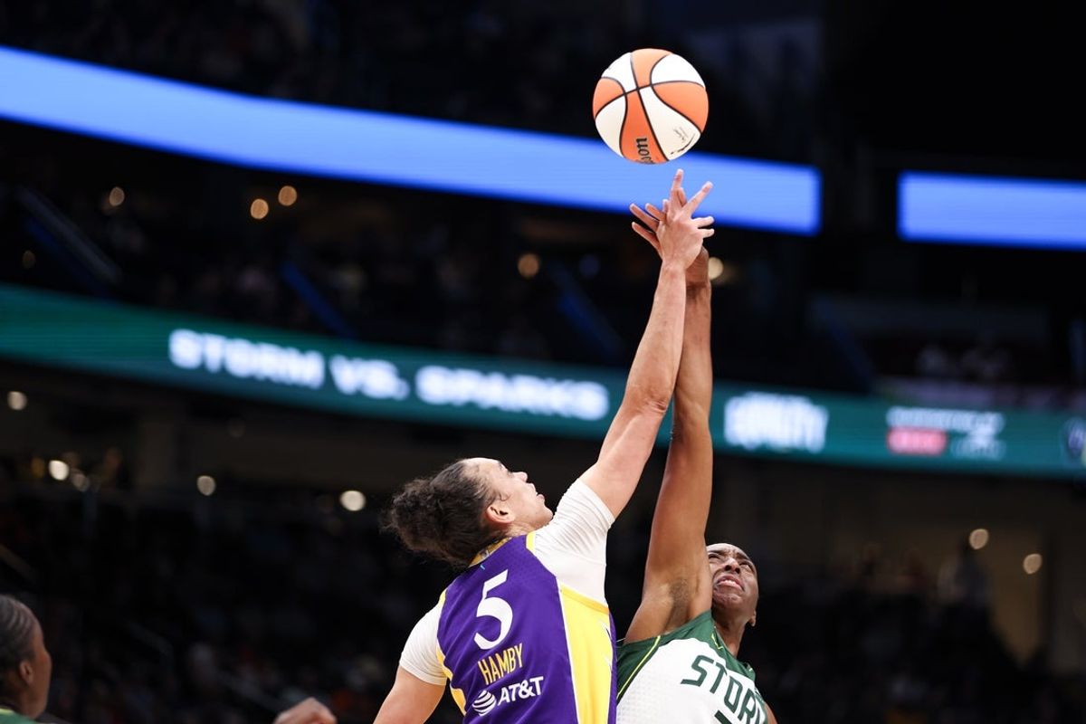 Aug 1, 2025; Seattle, Washington, USA; Seattle Storm forward Nneka Ogwumike (3) and Los Angeles Sparks forward Dearica Hamby (5) battle for a jump ball during the first half at Climate Pledge Arena. Mandatory Credit: Kevin Ng-Imagn Images