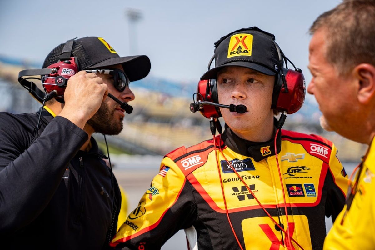 Connor Zilisch (88) listens to a member of his crew during NASCAR Xfinity Series qualifying on Aug. 2, 2025, at Iowa Speedway in Newton, Iowa.