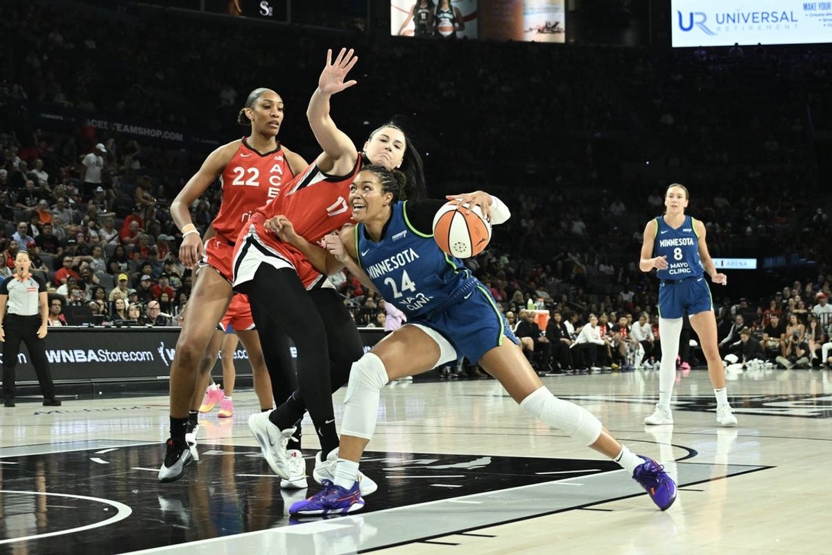 Aug 2, 2025; Las Vegas, Nevada, USA; Minnesota Lynx forward Napheesa Collier (24) drives against Las Vegas Aces center Megan Gustafson (17) during the first quarter of their game at Michelob Ultra Arena. Mandatory Credit: Candice Ward-Imagn Images