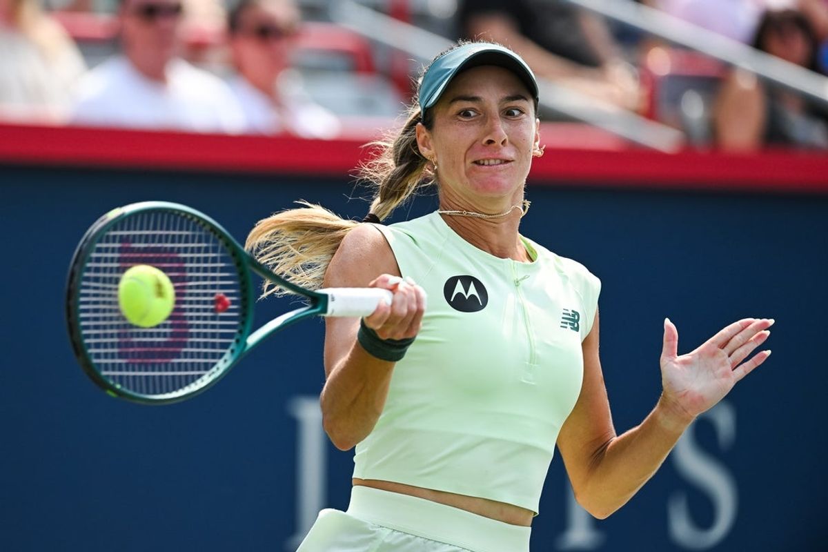 Aug 2, 2025; Montreal, QC, Canada; Mccartney Kessler (USA) returns the ball to Marta Kostyuk (UKR) in fourth round play at IGA Stadium. Mandatory Credit: David Kirouac-Imagn Images
