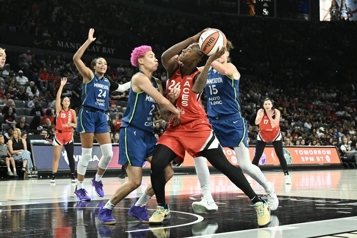 Aug 2, 2025; Las Vegas, Nevada, USA; Las Vegas Aces guard Jewell Loyd (24) collides with Minnesota Lynx guard Natisha Hiedeman (2) during the third quarter of their game at Michelob Ultra Arena. Mandatory Credit: Candice Ward-Imagn Images