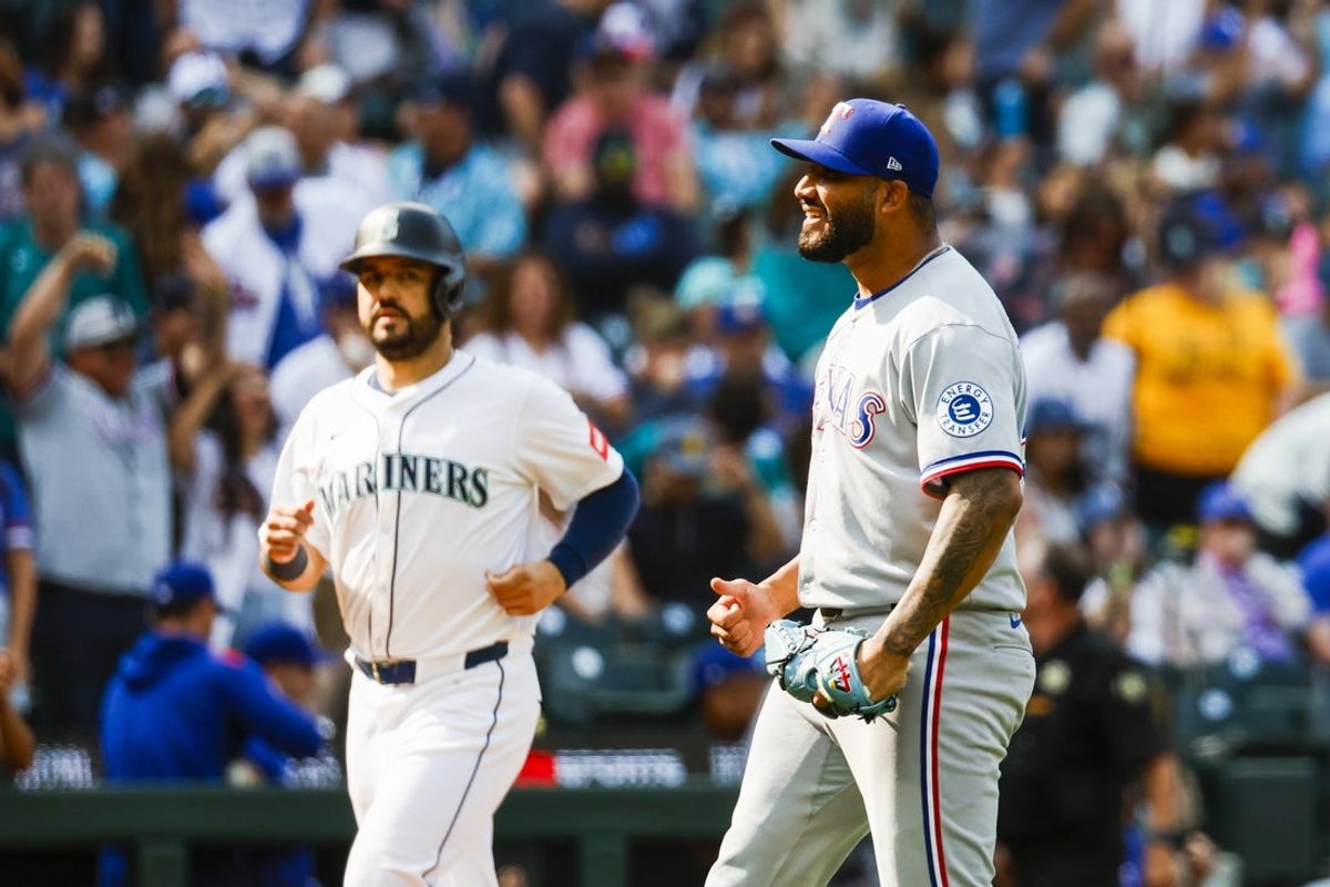 Aug 2, 2025; Seattle, Washington, USA; Texas Rangers pitcher Luis Curvelo (57) celebrates following a victory against the Seattle Mariners during the eleventh inning at T-Mobile Park. Mandatory Credit: Joe Nicholson-Imagn Images