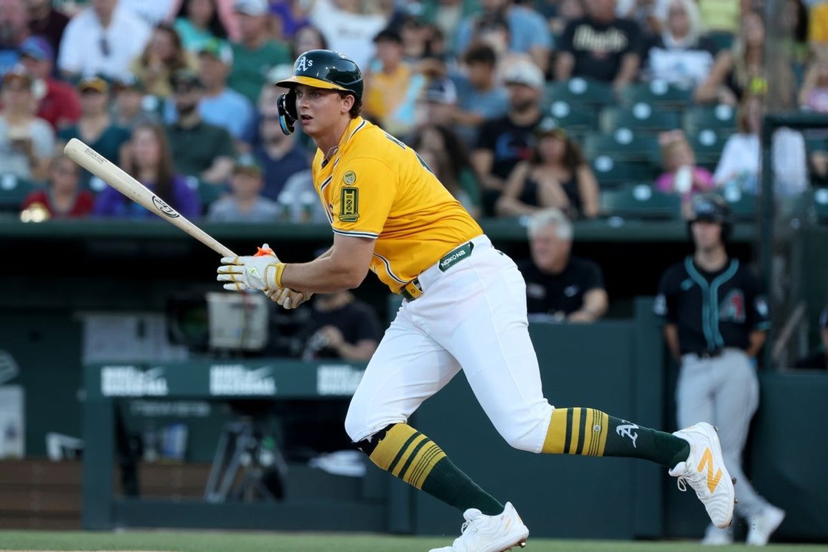 Aug 2, 2025; West Sacramento, California, USA; Athletics first baseman Nick Kurtz (16) hits a single against the Arizona Diamondbacks during the first inning at Sutter Health Park. Mandatory Credit: Dennis Lee-Imagn Images