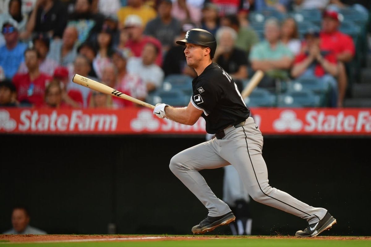 Aug 2, 2025; Anaheim, California, USA; Chicago White Sox catcher Kyle Teel (8) hits an RBI single against the Los Angeles Angels during the second inning at Angel Stadium. Mandatory Credit: Gary A. Vasquez-Imagn Images