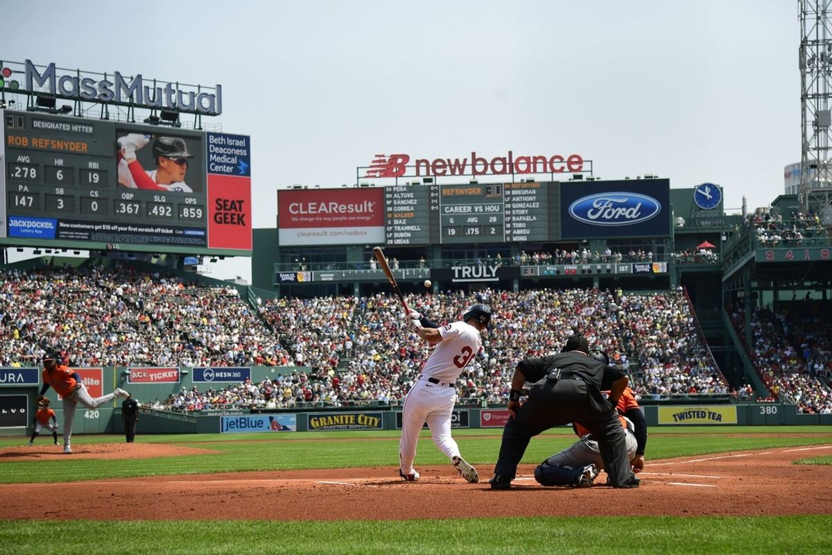 Aug 3, 2025; Boston, Massachusetts, USA;  Boston Red Sox designated hitter Rob Refsnyder (30) hits a single during the first inning against the Houston Astros at Fenway Park. Mandatory Credit: Bob DeChiara-Imagn Images