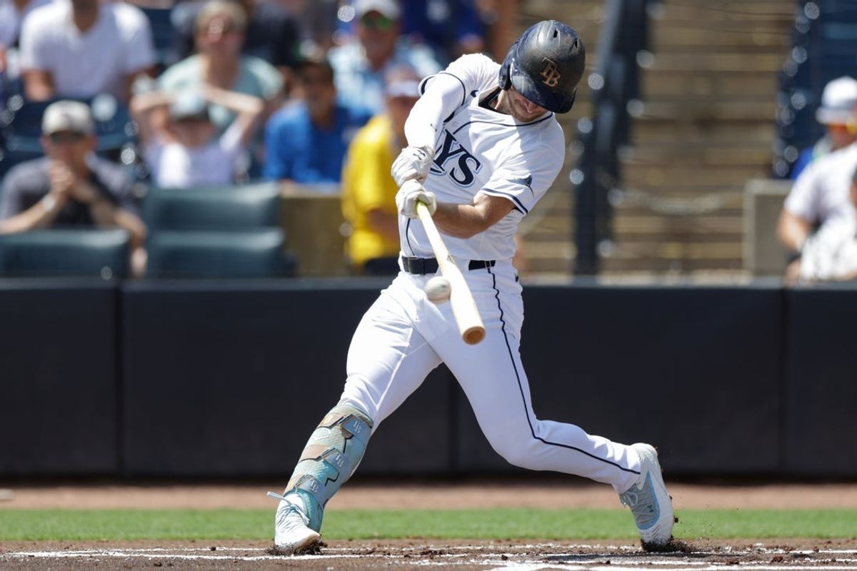Aug 3, 2025; Tampa, Florida, USA; Tampa Bay Rays first baseman Brandon Lowe (8) singles against the Los Angeles Dodgers in the first inning at George M. Steinbrenner Field. Mandatory Credit: Nathan Ray Seebeck-Imagn Images