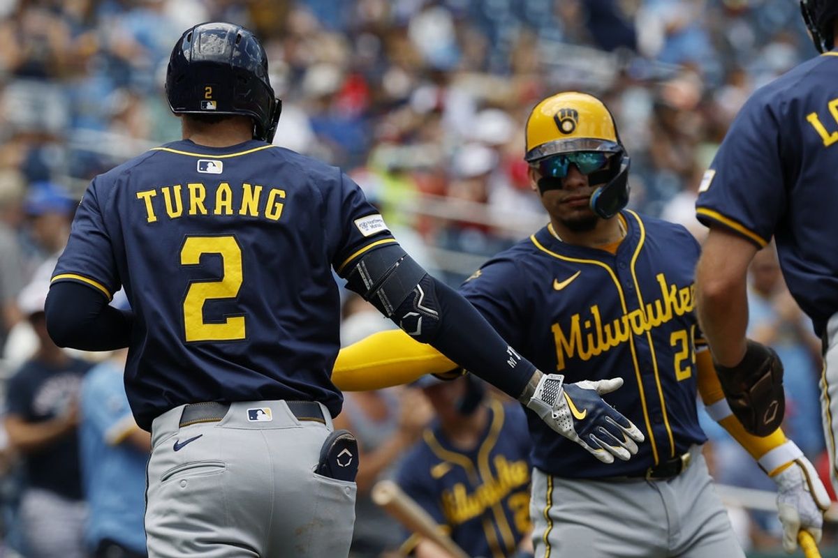 Aug 3, 2025; Washington, District of Columbia, USA; Milwaukee Brewers second baseman Brice Turang (2) celebrates with Brewers catcher William Contreras (24) after hitting a two run home run against the Washington Nationals during the second inning at Nationals Park. Mandatory Credit: Geoff Burke-Imagn Images