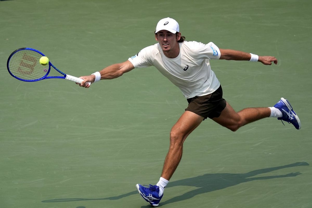 Aug 3, 2025; Toronto, ON, Canada; Alex De Minaur (AUS) stretches to get to a ball hit by Frances Tiafoe (not pictured)  during round four at Sobeys Stadium. Mandatory Credit: John E. Sokolowski-Imagn Images