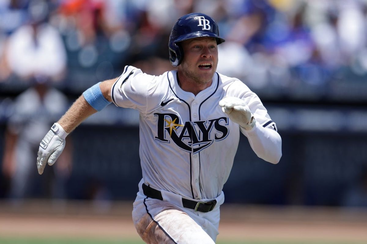 Aug 3, 2025; Tampa, Florida, USA; Tampa Bay Rays shortstop Taylor Walls (6) singles against the Los Angeles Dodgers in the fifth inning at George M. Steinbrenner Field. Mandatory Credit: Nathan Ray Seebeck-Imagn Images