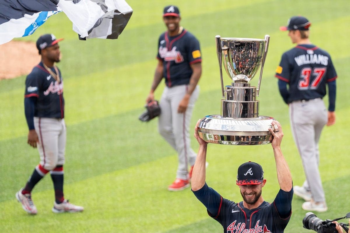 Eli White of the Atlanta Braves holds the trophy after the Braves defeated the Cincinnati Reds in the MLB Speedway Classic held at Bristol Motor Speedway in Bristol, Tenn., on August 3, 2025.