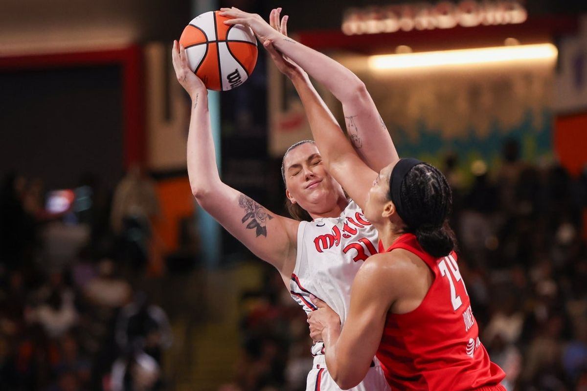 Aug 3, 2025; College Park, Georgia, USA; Washington Mystics center Stefanie Dolson (31) is defended by Atlanta Dream forward Brionna Jones (24) in the first quarter at Gateway Center Arena at College Park. Mandatory Credit: Brett Davis-Imagn Images