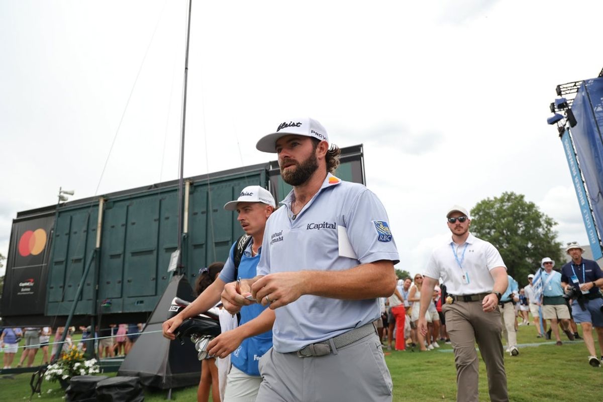 Aug 3, 2025; Greensboro, North Carolina, USA; Cameron Young walks from the 9th green to 10th tee box during the final round of the Wyndham Championship golf tournament. Mandatory Credit: Allison Lawhon-Imagn Images