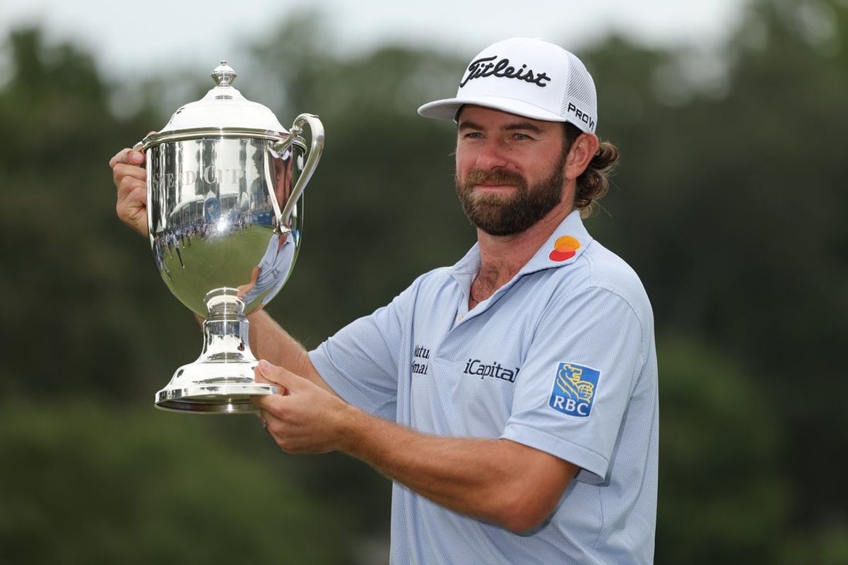 Aug 3, 2025; Greensboro, North Carolina, USA; Cameron Young with the Sam Snead Cup after the final round of the Wyndham Championship golf tournament. Mandatory Credit: Allison Lawhon-Imagn Images
