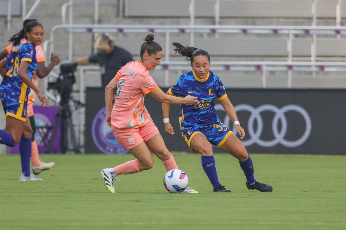 Aug 3, 2025; Orlando, Florida, USA; Orlando Pride midfielder Morgan Gautrat (16) battles for the ball against Utah Royals FC midfielder Aria Nagal (33) during the first half at Inter&Co Stadium. Mandatory Credit: Mike Watters-Imagn Images