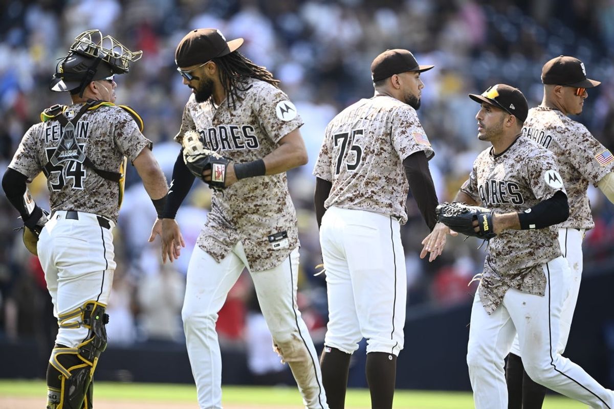 Aug 3, 2025; San Diego, California, USA; San Diego Padres players celebrate after the Padres beat the St. Louis Cardinals at Petco Park. Mandatory Credit: Denis Poroy-Imagn Images