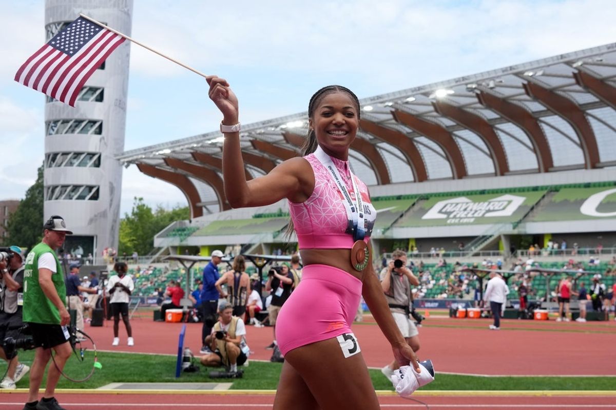 Aug 3, 2025; Eugene, OR, USA; Gabby Thomas takes a victory lap after placing third in the women's 200m during the USATF Championships at Hayward Field. Mandatory Credit: Kirby Lee-Imagn Images