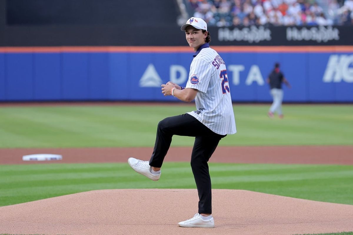 Aug 4, 2025; New York City, New York, USA; New York Islanders first overall draft pick Matthew Schaefer throws out a ceremonial first pitch before a game between the New York Mets and the Cleveland Guardians at Citi Field. Mandatory Credit: Brad Penner-Imagn Images