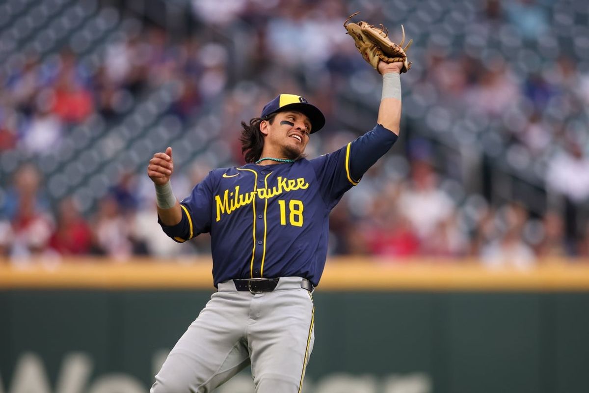 Aug 4, 2025; Atlanta, Georgia, USA; Milwaukee Brewers third baseman Anthony Seigler (18) catches a pop fly against the Atlanta Braves in the first inning at Truist Park. Mandatory Credit: Brett Davis-Imagn Images