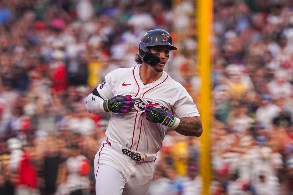 Aug 4, 2025; Boston, Massachusetts, USA; Boston Red Sox outfielder Jarren Duran (16) hits a three run home run against the Kansas City Royals in the first inning at Fenway Park. Mandatory Credit: David Butler II-Imagn Images