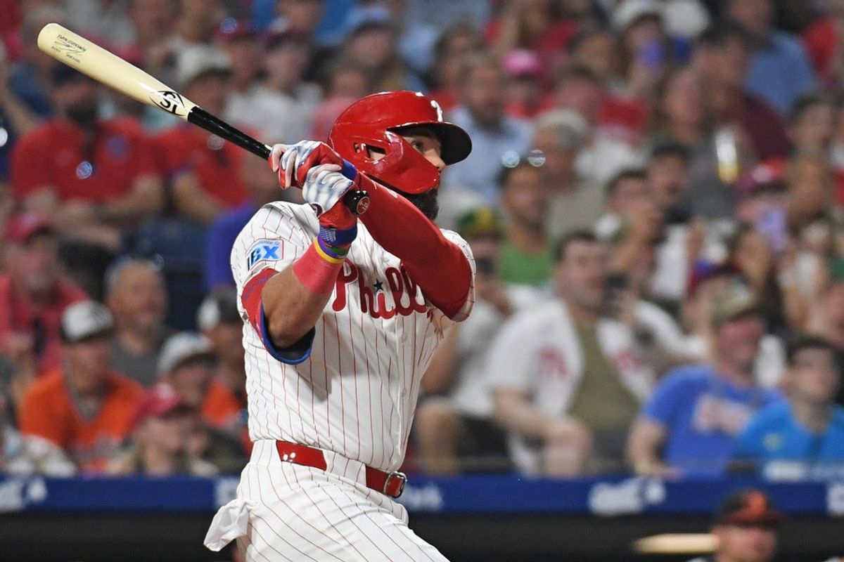 Aug 4, 2025; Philadelphia, Pennsylvania, USA; Philadelphia Phillies outfielder Kyle Schwarber (12) watches his grand slam home run during the sixth inning against the Baltimore Orioles at Citizens Bank Park. Mandatory Credit: Eric Hartline-Imagn Images