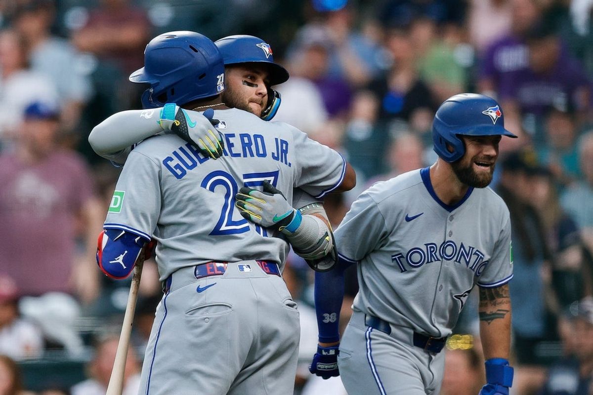 Aug 4, 2025; Denver, Colorado, USA; Toronto Blue Jays designated hitter Bo Bichette (11) celebrates his two run home run with first baseman Vladimir Guerrero Jr. (27) and right fielder Nathan Lukes (38) in the third inning against the Colorado Rockies at Coors Field. Mandatory Credit: Isaiah J. Downing-Imagn Images