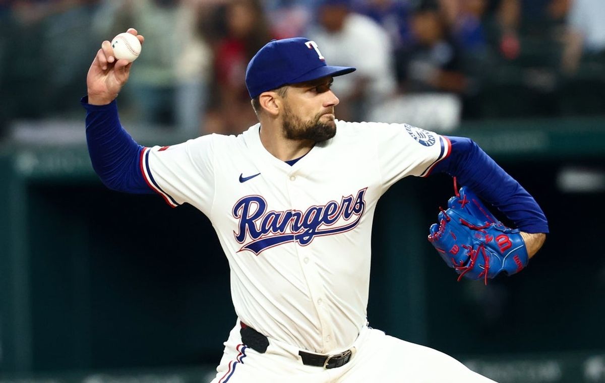 Aug 5, 2025; Arlington, Texas, USA;  Texas Rangers starting pitcher Nathan Eovaldi (17) throws during the first inning against the New York Yankees at Globe Life Field. Mandatory Credit: Kevin Jairaj-Imagn Images