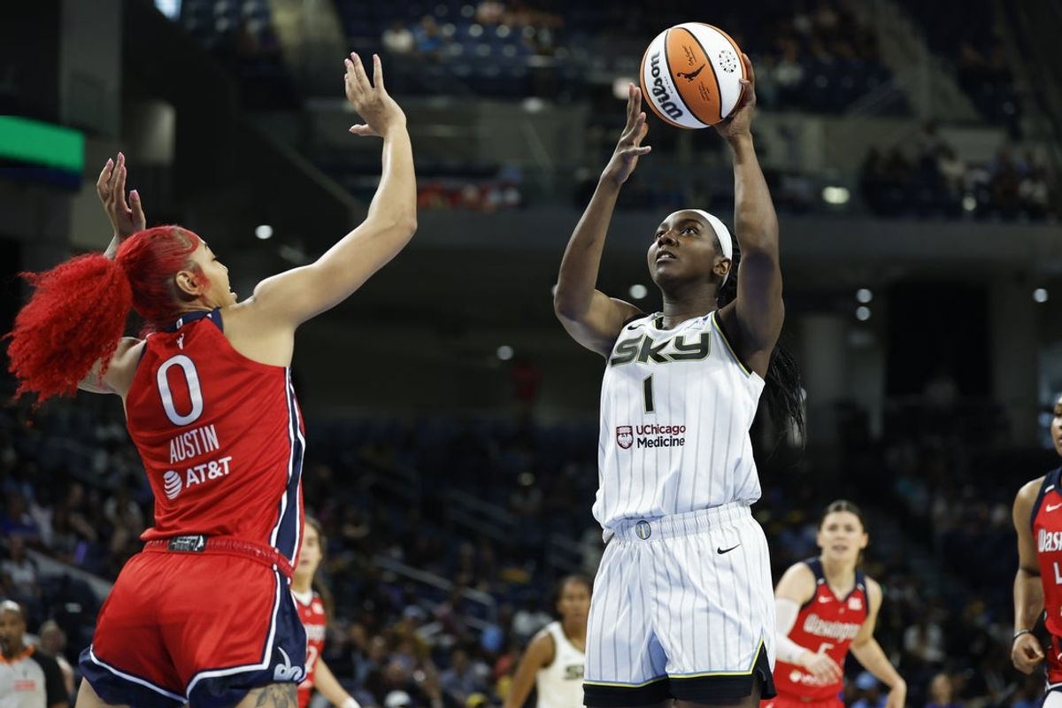 Aug 5, 2025; Chicago, Illinois, USA; Chicago Sky center Elizabeth Williams (1) shoots against Washington Mystics forward Shakira Austin (0) during the first half at Wintrust Arena. Mandatory Credit: Kamil Krzaczynski-Imagn Images