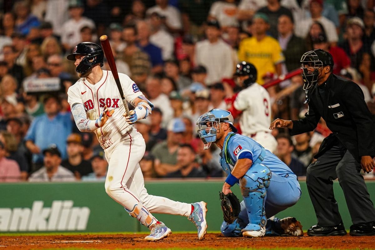 Aug 5, 2025; Boston, Massachusetts, USA; Boston Red Sox shortstop Trevor Story (10) hits a single to drive in a run against the Kansas City Royals in the seventh inning at Fenway Park. Mandatory Credit: David Butler II-Imagn Images