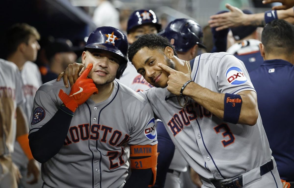 Aug 5, 2025; Miami, Florida, USA;  Houston Astros catcher Yainer Diaz (21) and shortstop Jeremy Pena (3) pose for a picture in the dugout after Diaz home run against the Miami Marlins during the fifth inning at loanDepot Park. Mandatory Credit: Rhona Wise-Imagn Images